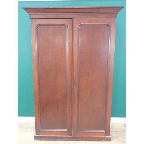 805 - A Victorian mahogany Wardrobe fitted pair of doors enclosing linen slides and three drawers