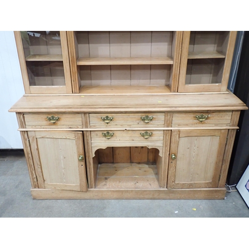 813 - A Victorian pine Dresser fitted pair of glazed doors flanking shelves above dog kennel base fitted f... 