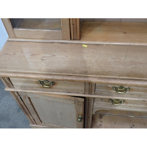 813 - A Victorian pine Dresser fitted pair of glazed doors flanking shelves above dog kennel base fitted f... 