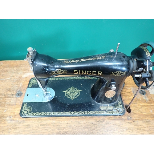 82 - A Singer Sewing Machine on stand, an oak Tea Trolley and a Wash Jug and Bowl