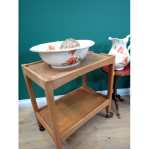 82 - A Singer Sewing Machine on stand, an oak Tea Trolley and a Wash Jug and Bowl