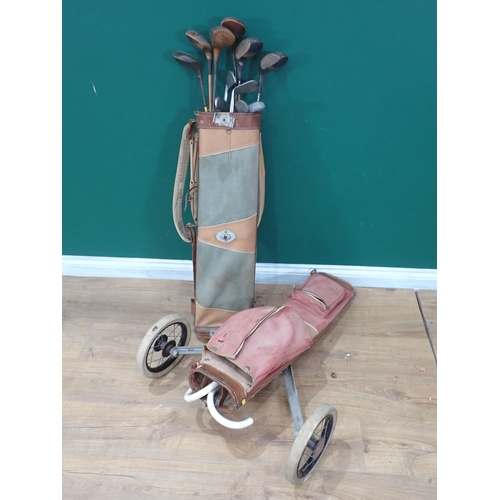 87 - Two Golf Bags with a collection of old Clubs