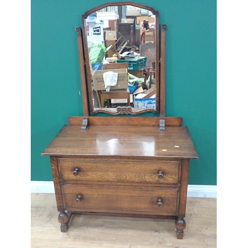 90 - An oak Chest of four drawers and a Dressing Chest fitted two drawers