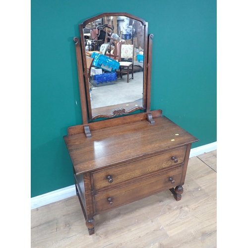 90 - An oak Chest of four drawers and a Dressing Chest fitted two drawers