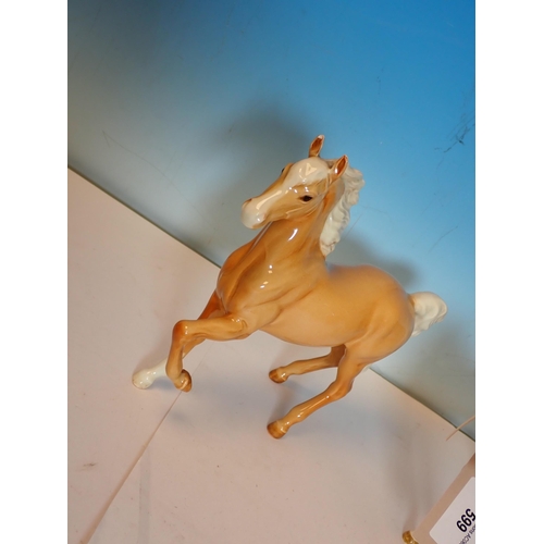 599 - Two Beswick palomino Horses and a Foal, two Beswick Welsh Ponies and a bay Foal