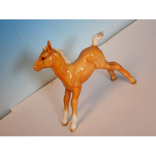 599 - Two Beswick palomino Horses and a Foal, two Beswick Welsh Ponies and a bay Foal