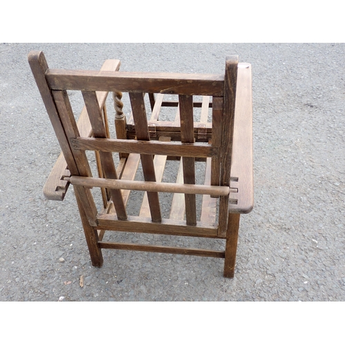 650 - A folding wooden Liner Chair,  with fold-out leg rest