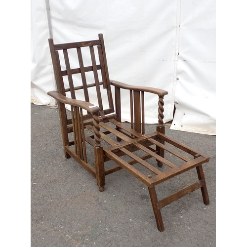 650 - A folding wooden Liner Chair,  with fold-out leg rest