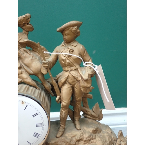 763 - A 19th Century gilded metal Mantel Clock with shooting man and hanging game surmount