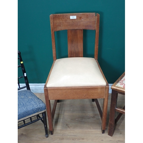 773 - Two oak Arts and Crafts Single Chairs and an ebonised child's Chair