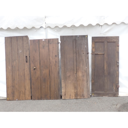 818 - An early oak Door and three other antique Doors