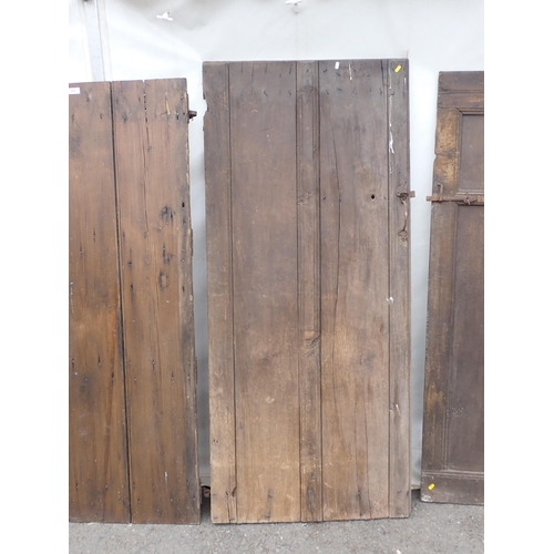 818 - An early oak Door and three other antique Doors