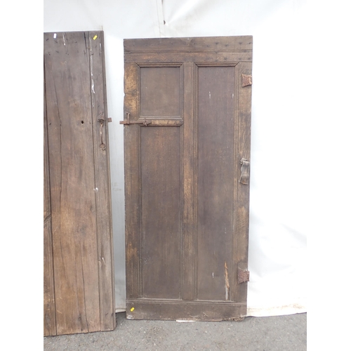 818 - An early oak Door and three other antique Doors