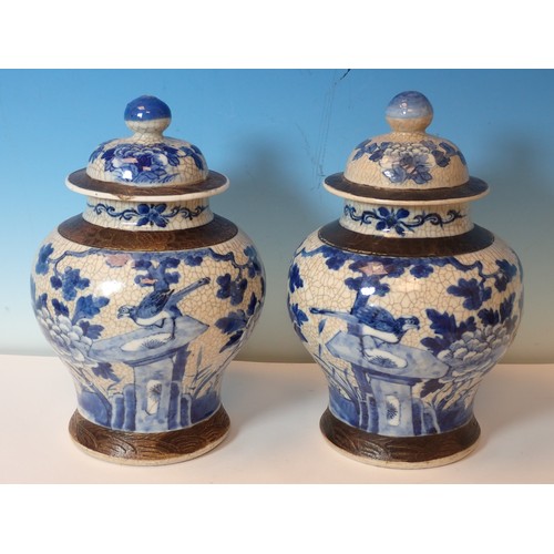 550 - A pair of Chinese blue and white crackleware lidded Vases, a Doulton stoneware Motto Jug (cracked), ... 