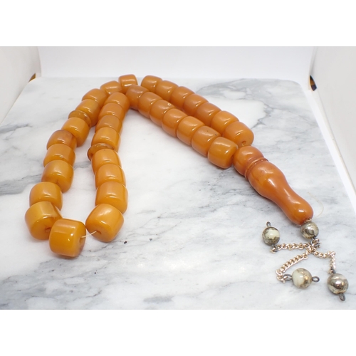 157 - An Amber type bead Necklace, approx 90gms