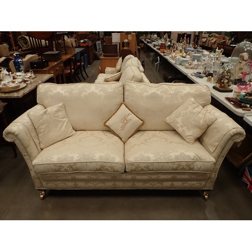 456 - A modern cream upholstered three piece Suite, consisting of a three seater Sofa 6ft 8in W x 3ft H, a... 