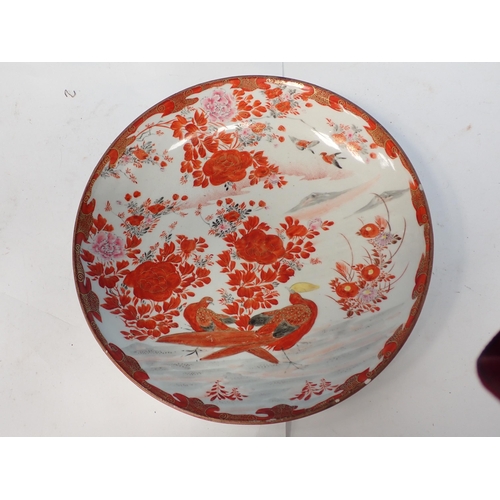 512 - A Satsuma Dish decorated exotic birds in a floral landscape, 12in Diam, small rim chip