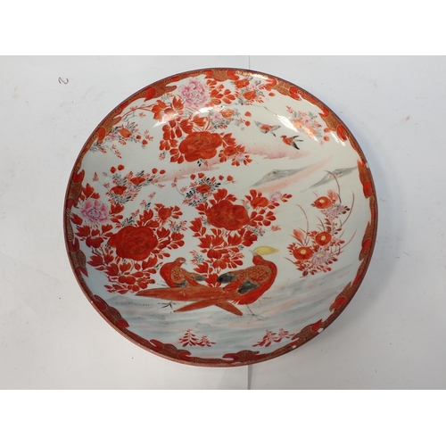 512 - A Satsuma Dish decorated exotic birds in a floral landscape, 12in Diam, small rim chip