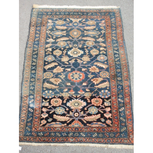 1 - An old bordered Ferahagn Rug with stylised leafage and rosette design on a blue ground, 6ft 4in x 4f... 