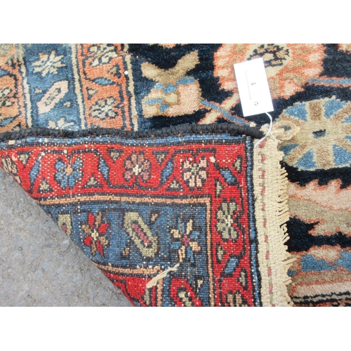 1 - An old bordered Ferahagn Rug with stylised leafage and rosette design on a blue ground, 6ft 4in x 4f... 