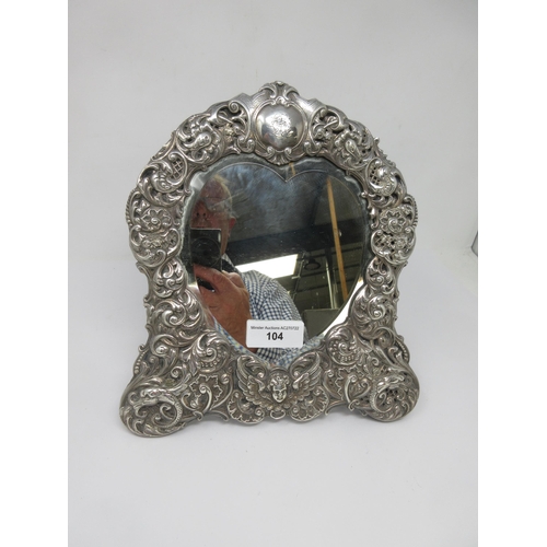 104 - A Victorian silver framed heart shape Easel Mirror with mask and scroll embossing, London 1897, make... 