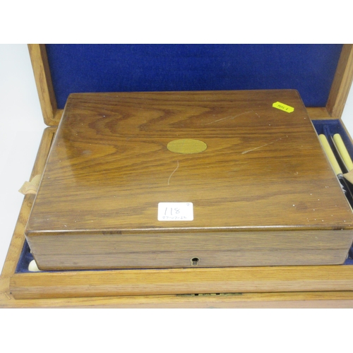 118 - An oak Case containing tray of Knives and Carvers, and a case of six Dessert Knives and Forks