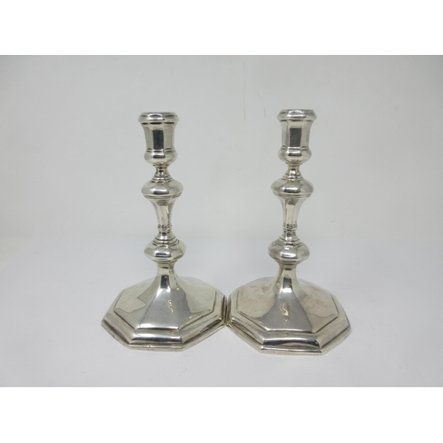 130 - A pair of Queen Anne silver Candlesticks with knopped stems on octagonal bases, engraved initials E.... 