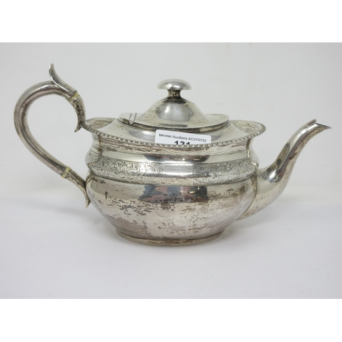 131 - A Victorian Irish silver oval Teapot with floral and leafage engraved frieze, beaded rim and scroll ... 