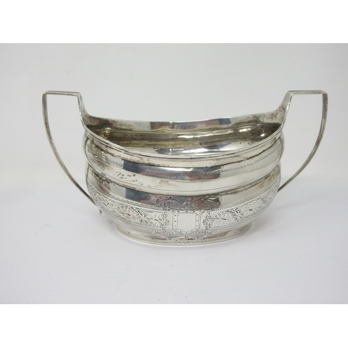 131 - A Victorian Irish silver oval Teapot with floral and leafage engraved frieze, beaded rim and scroll ... 