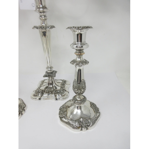 138 - A pair of plated Candlesticks with leafage columns, and a similar two-branch Candle Holder, repaired