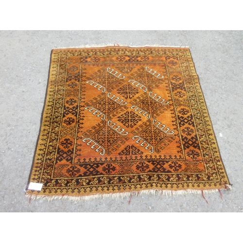 14 - A bordered Afghan Rug with stylised gul having latch hooks on a mustard ground