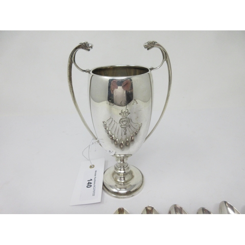 140 - A silver two-handled Golf Trophy, Birmingham 1937, and eleven Golf Spoons