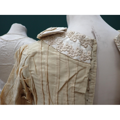 211 - An Edwardian cream Wedding Dress with embroidered satin collar, a 1930's satin bias-cut Wedding Dres... 