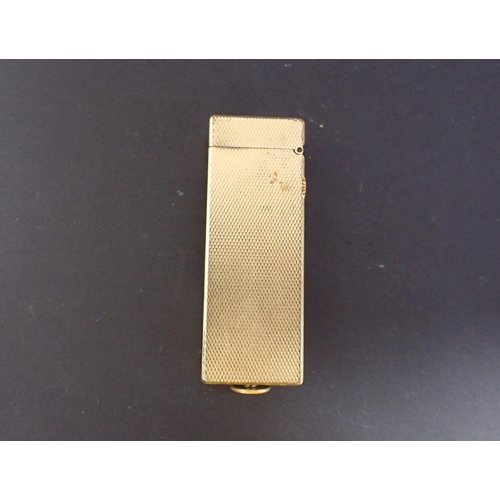 220 - A gold plated Dunhill Cigarette Lighter