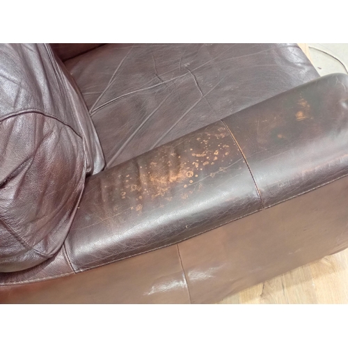 248 - A brown leather effect two seater Sofa and an Armchair