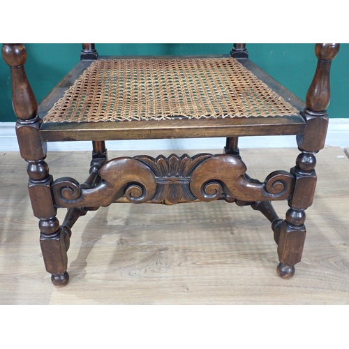 263 - A pair of Charles II style walnut Elbow Chairs with can backs and seats