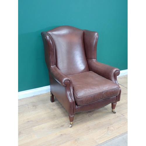 300 - A leather type upholstered Library Chair with turned front supports and casters