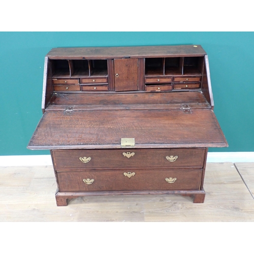 307 - An 18th Century oak Bureau with fitted interior above short and long drawers, 3ft 7in W A/F