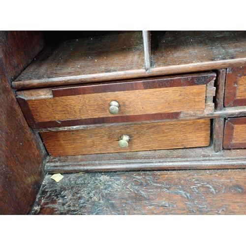 307 - An 18th Century oak Bureau with fitted interior above short and long drawers, 3ft 7in W A/F