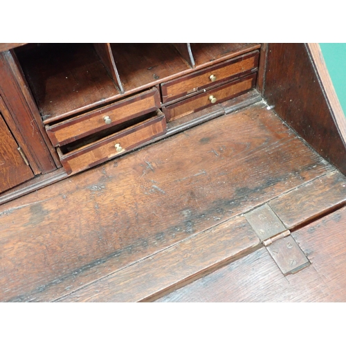 307 - An 18th Century oak Bureau with fitted interior above short and long drawers, 3ft 7in W A/F