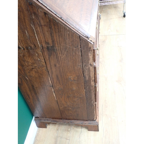 307 - An 18th Century oak Bureau with fitted interior above short and long drawers, 3ft 7in W A/F