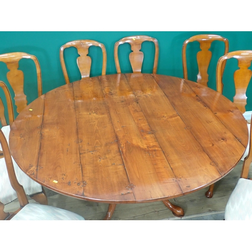 310 - A Bylaws cherrywood circular Dining Table and eight matching Chairs, the table with turned column an... 