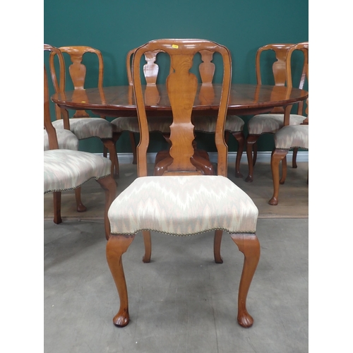 310 - A Bylaws cherrywood circular Dining Table and eight matching Chairs, the table with turned column an... 