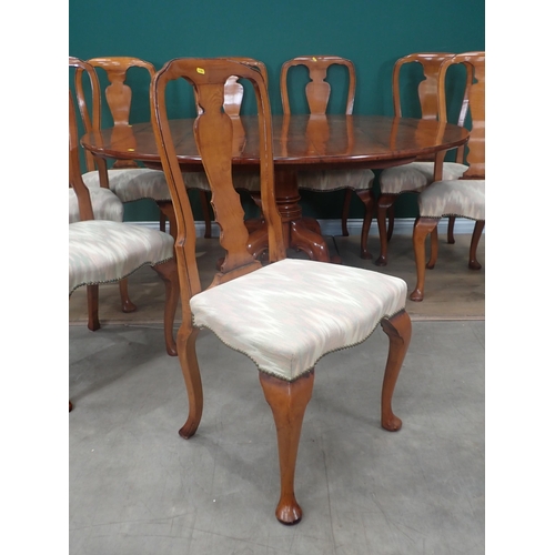 310 - A Bylaws cherrywood circular Dining Table and eight matching Chairs, the table with turned column an... 