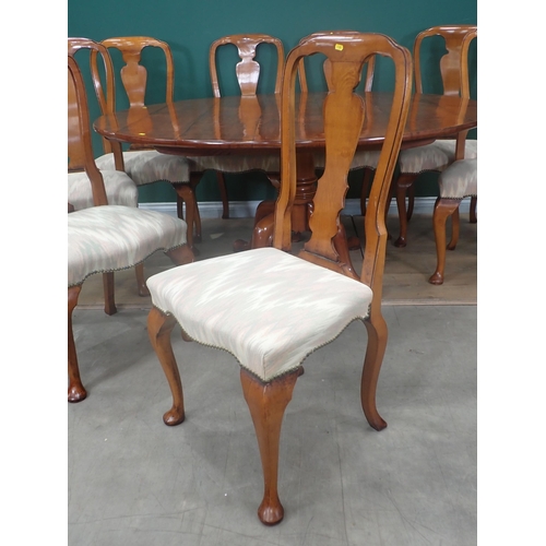 310 - A Bylaws cherrywood circular Dining Table and eight matching Chairs, the table with turned column an... 