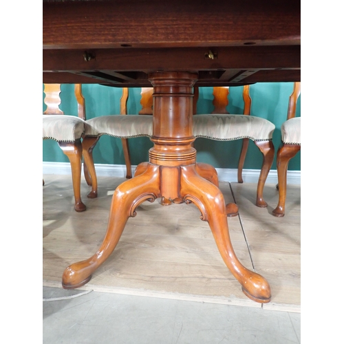 310 - A Bylaws cherrywood circular Dining Table and eight matching Chairs, the table with turned column an... 