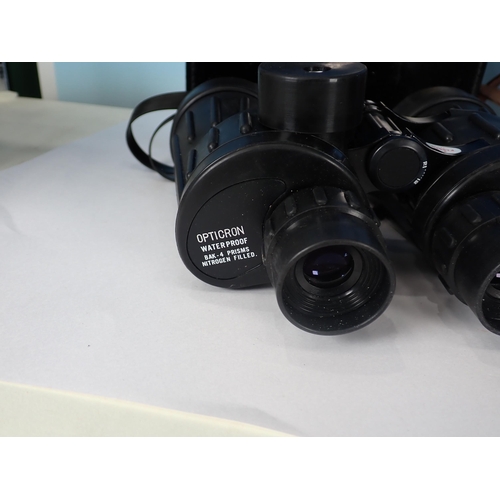 311 - A pair of Opticron water proof Binoculars, 7 x 50 and two others