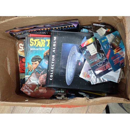 328 - A box of Annuals including Star Trek, boxed Toys etc