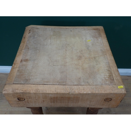 331 - A Butcher's Block on turned supports, 2ft square x 2ft 5in H