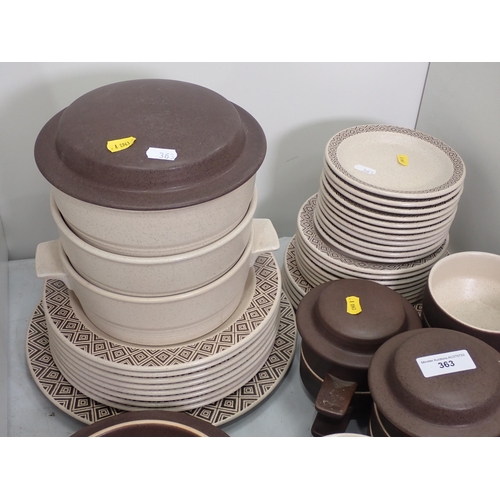 363 - A brown pottery Breakfast Services including Tureens, Plates, Bowls etc